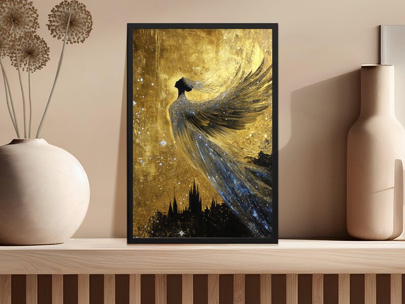 May include: A black and gold framed print of a woman with wings, standing in front of a city skyline. The background is a golden color with a starry night sky.