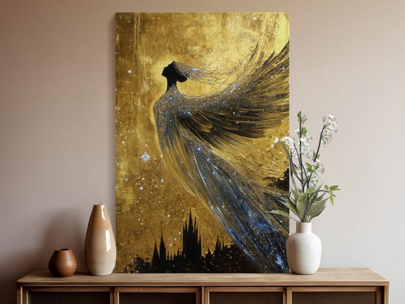 May include: A black silhouette of a woman with wings against a gold background with glitter. The woman is wearing a flowing gown and has her head tilted back. The background is a textured gold with a hint of blue.