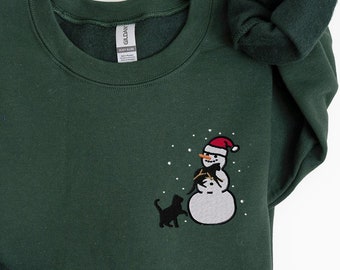Gesticktes Weihnachtsschneemann-Sweatshirt, schwarze Katzenweihnachtshemd, Schneemannhemd, Feiertagspullover, Katzenliebhabergeschenk, Weihnachtshemd Frauen