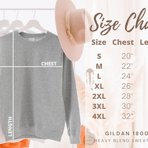 May include: Size chart for a Gildan 18000 heavy blend sweatshirt. The chart shows the chest and length measurements in inches for sizes S through 4XL.