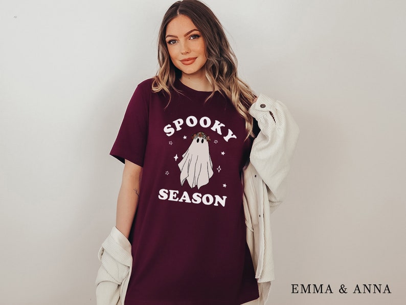 May include: A maroon t-shirt with a white ghost graphic and the text "Spooky Season".