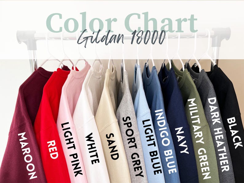 May include: Color chart for Gildan 18000 sweatshirts, showing 11 different colors: maroon, red, light pink, white, sand, sport grey, light blue, indigo blue, navy, military green, dark heather, and black.