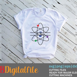 May include: White t-shirt with a black and blue atom design and the text "Mr. Navton" in a banner.