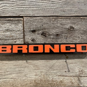 Solo Bronco Orange On Black, Throwback Fender Badges, Acrylic Badges , New body style Emblems