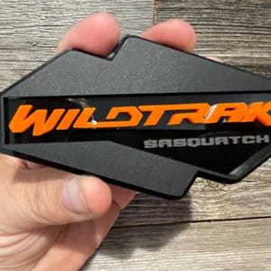 NEW &quot;WILDTRAK-SASQUATCH&quot; Orange On Black On Matte Black, Fender Badges, Acrylic Badges , New body style Emblems