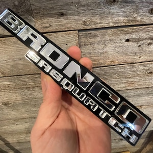 NEW &quot;SASQUATCH&quot; Throwback Fender Badges, Chrome Text on Gloss Black Background.