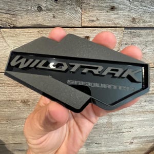 NEW &quot;WILDTRAK-SASQUATCH&quot; Reversed Blackout, Matte Black On Gloss Black, Fender Badges, Acrylic Badges , New body style Emblems