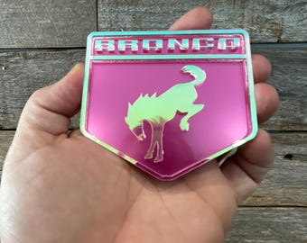 Pink Metallic/Iridescent Pink Bucking Br0nc0 Badge: Acrylic Emblem