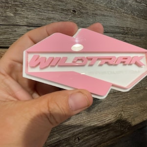 NEW &quot;WILDTRAK-SASQUATCH&quot; Pink On White, Fender Badges, Acrylic Badges , New body style Emblems