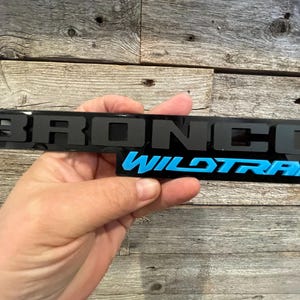 NEW &quot;WILDTRAK&quot; Matte Black upper and Blue Lower Text on GLoss Black Background, (MANY Colors Available!!!)