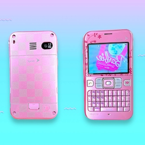 May include: A pink Sprint cell phone with a checkerboard pattern on the back and a screen displaying a Barbie image. The phone has a QWERTY keyboard and floral accents. The camera is 1.3 megapixels.
