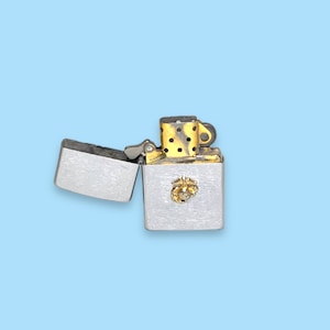 Vintage Silver Zippo Lighter. Gold Emblem.