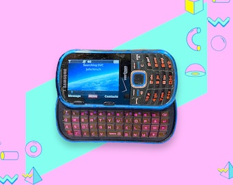 Teléfono móvil Samsung deslizable vintage del año 2000. Funciona.