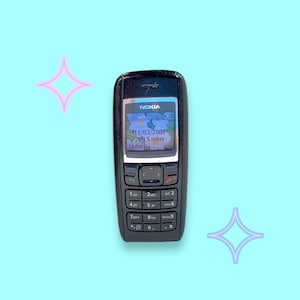 May include: A black Nokia cell phone with a screen displaying the date 11/03/2007 and the text "209.5 mins Unlock". The phone has a keypad with numbers and a navigation button. The background is light blue with star-shaped graphics.