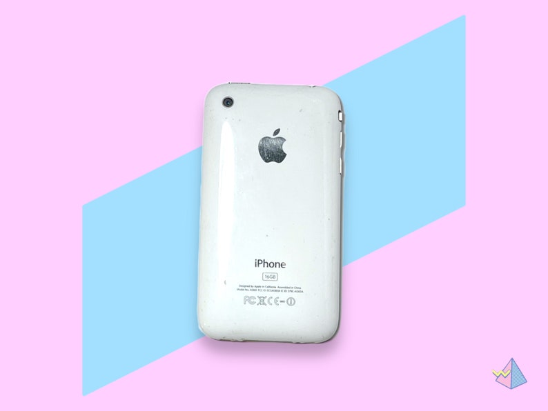 May include: A white iPhone 16GB model, viewed from the back, featuring the Apple logo. The phone has a glossy finish and is set against a pink and blue geometric background.