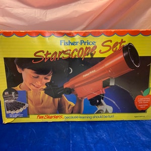 May include: A vintage Fisher-Price Starscope Set box. The box features a child looking through a red telescope. The box has the text "Starscope Set" and "Fun Starters... because learning should be fun!" on a yellow background.