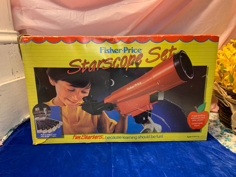 May include: A vintage Fisher-Price Starscope Set box. The box features a child looking through a red telescope. The box has the text "Starscope Set" and "Fun Starters... because learning should be fun!" on a yellow background.