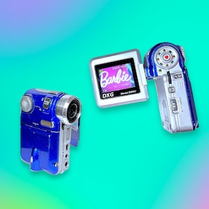 May include: Three digital video cameras are displayed against a gradient background. One is blue, the other two are silver and blue. One camera has a screen displaying the word "Barbie". The cameras are in different positions, suggesting they are in use.