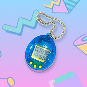 May include: A blue handheld digital pet game with a silver chain. The screen displays the time as 6:30 and 12:00. The game has three yellow buttons below the screen. The background is a gradient of blue and purple with geometric shapes.
