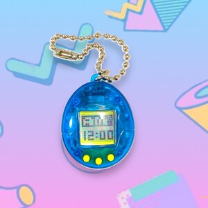 May include: A blue handheld digital pet game with a gold chain. The screen displays a digital interface with the time 12:00. The device has three yellow buttons below the screen. The background is a gradient of blue and purple with 90s-style geometric shapes.