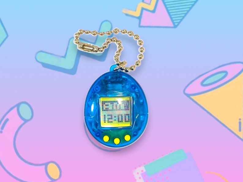 May include: A blue handheld digital pet game with a gold chain. The screen displays a digital interface with the time 12:00. The device has three yellow buttons below the screen. The background is a gradient of blue and purple with 90s-style geometric shapes.
