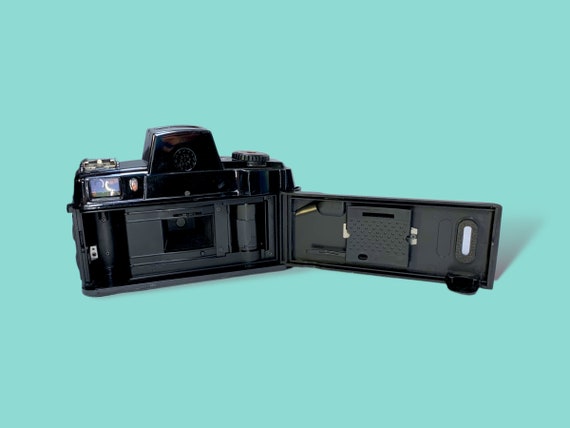 フィルムカメラ CANON A-1with motordrive/daypack/2lenses il_340x270.4592335897_4i46.jpg