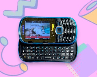 Teléfono móvil Samsung deslizable vintage del año 2000. Funciona.
