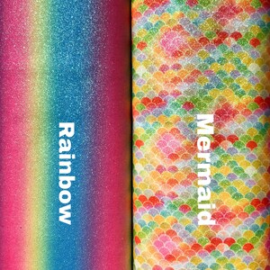 May include: Two rolls of glitter fabric, one with a rainbow gradient and the other with a mermaid scale pattern. The fabric is labeled "Rainbow" and "Mermaid".