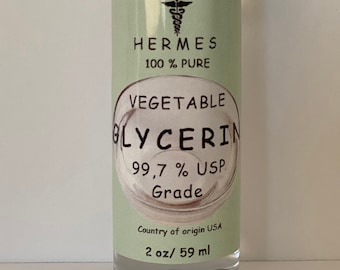 May include: A clear glass bottle with a white cap, containing vegetable glycerin. The label is green and white and reads "HERMES 100% PURE VEGETABLE GLYCERIN 99.7% USP Grade Country of origin USA 2 oz/ 59 ml".