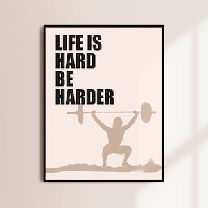 May include: A motivational poster with a beige background and black text that reads "Life is hard be harder". A silhouette of a person lifting a barbell is shown in the center of the poster.