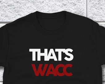 May include: Black t-shirt with the text "THAT'S WACC" in white and red letters.