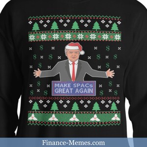 May include: Black sweatshirt with a festive pattern featuring green Christmas trees, snowflakes, and dollar signs. The design includes a cartoon image of a man wearing a Santa hat and the text "MAKE SPACs GREAT AGAIN".