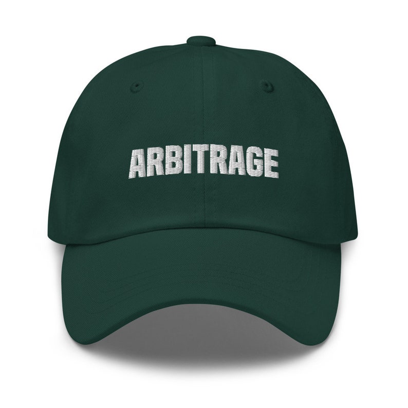 May include: A dark green baseball cap with the word "ARBITRAGE" embroidered in white on the front.