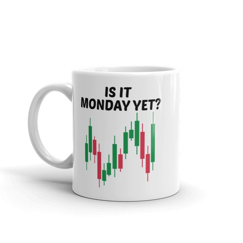 May include: White ceramic coffee mug with a black graphic that reads "Is it Monday yet?" and a green and red candlestick chart.