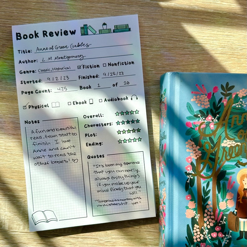 May include: A book review template with a white background and black grid lines. The title of the book is "Anne of Green Gables" by L.M. Montgomery. The review includes ratings for overall, characters, plot, and ending. There are also notes and quotes from the book. The book is categorized as classic, historical, and fiction.