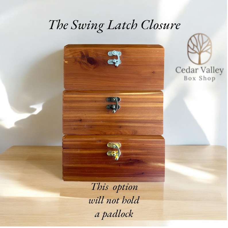 May include: Three wooden boxes stacked on top of each other. Each box has a different type of latch. The top box has a silver latch, the middle box has a black latch, and the bottom box has a gold latch. The boxes are made of cedar wood and have a natural wood finish. The text "The Swing Latch Closure" is at the top of the image. The text "This option will not hold a padlock" is at the bottom of the image. The text "Cedar Valley Box Shop" is in the upper right corner of the image.
