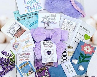 May include: A gift box filled with self-care items. Includes a lavender eye mask, headband, socks, tea bags, face towel, serum mask, and a keychain. The box also contains cards with encouraging messages.
