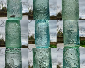 Pictorial Codd Bottles - antique mineral water bottles with marble stopper