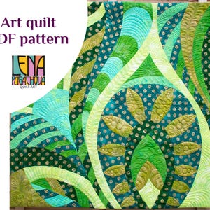 May include: A green, yellow, and blue art quilt with a geometric pattern. The quilt is made up of different shapes and sizes of fabric, and it has a modern and abstract design. The quilt is titled "Lena Pugachova Quilt Art".