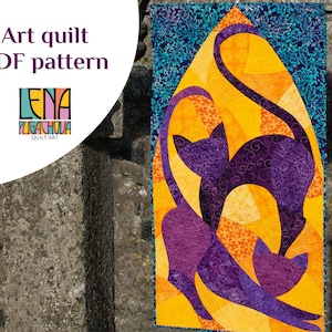 May include: Art quilt PDF pattern featuring a vibrant design of two stylized purple cats against a yellow and orange background. The quilt has a blue floral border and includes the text "Art quilt PDF pattern" and the designer's logo.