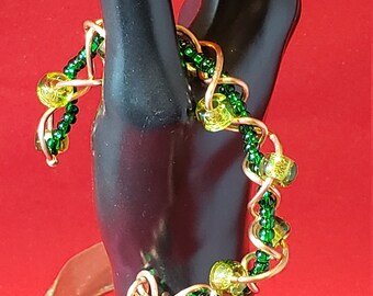 Copper wire twist bangle with green glass beads
