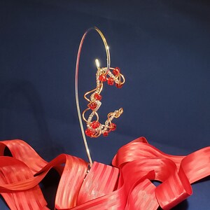 Copper wire twist bangle with red Czech glass beads
