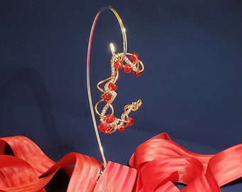 Copper wire twist bangle with red Czech glass beads