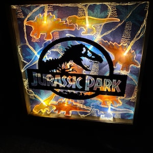 Cadre lumineux Jurassic Park, art mural Jurassic World, dinosaure lumineux, boîte à ombres logo, lampe à LED dinosaure, décoration de film, cadeau fête des pères