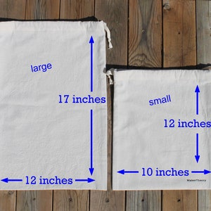 May include: Two white cotton drawstring bags, one labeled "large" measuring 17 inches tall and 12 inches wide, and the other labeled "small" measuring 12 inches tall and 10 inches wide.