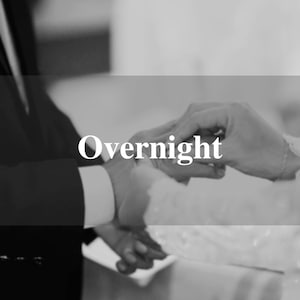 May include: Black and white image of two people's hands, one in a suit and the other in a dress, possibly a wedding. The word "Overnight" is overlaid on the image in white text.