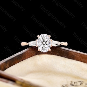 Vintage oval cut moissanite engagement ring rose gold ring unique three stone ring tapered baguette cut ring anniversary promise ring