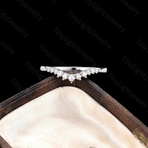 a close up of a ring in a box