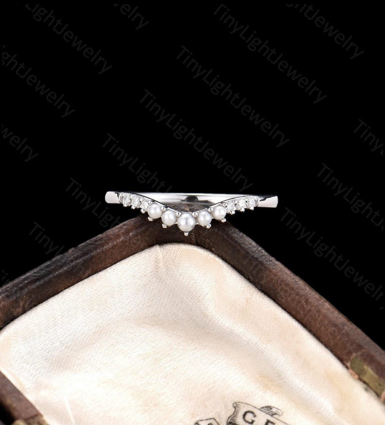 a close up of a ring in a box