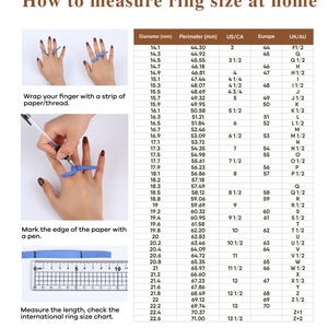 a person's hands wearing rings of different sizes, with a ruler and a pen for marking the edge of the paper.